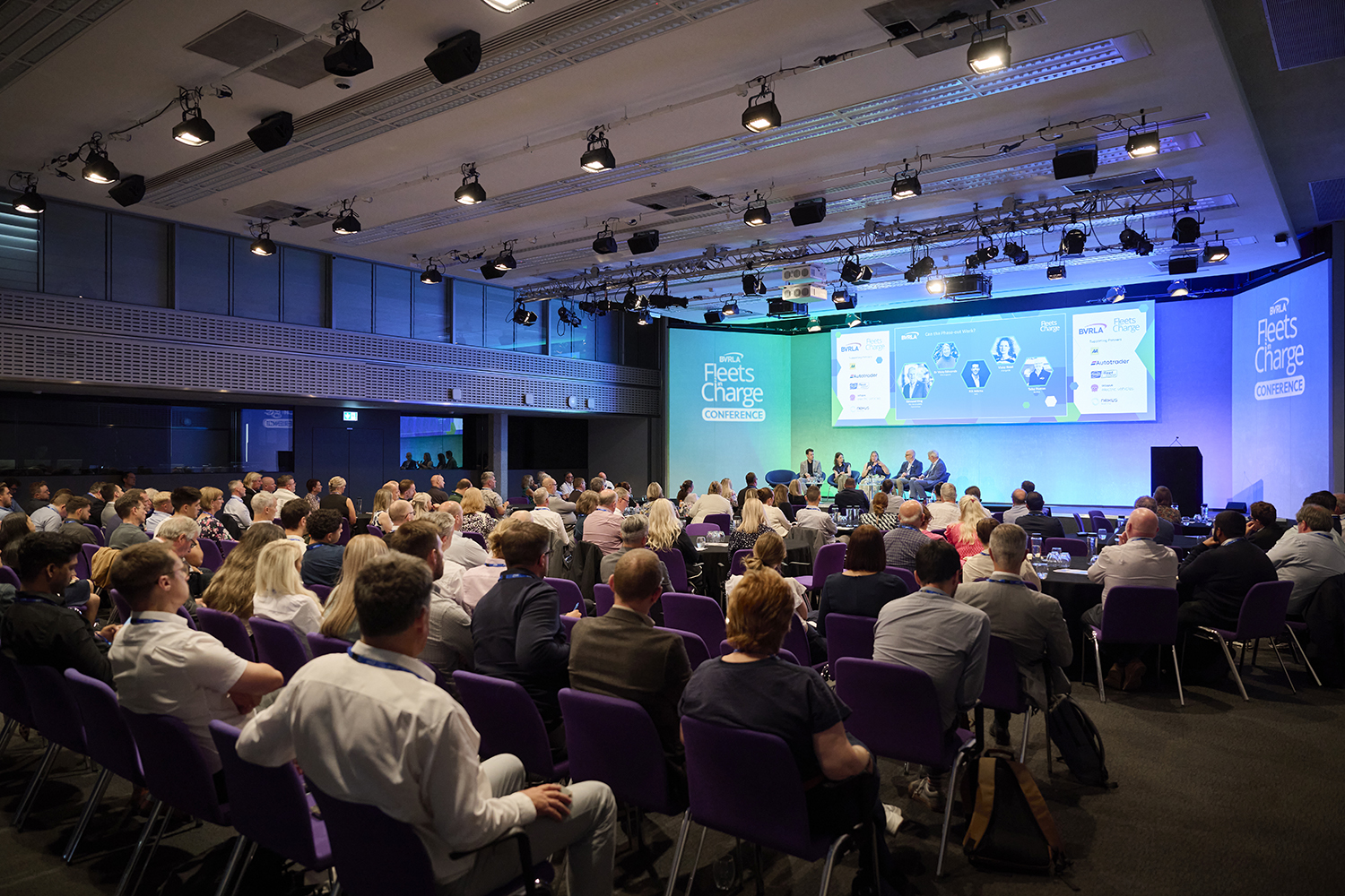 Leaders panel on stage at wide shot of the crowd at the BVRLA's Fleets in Charge Conference 2025 in July in London