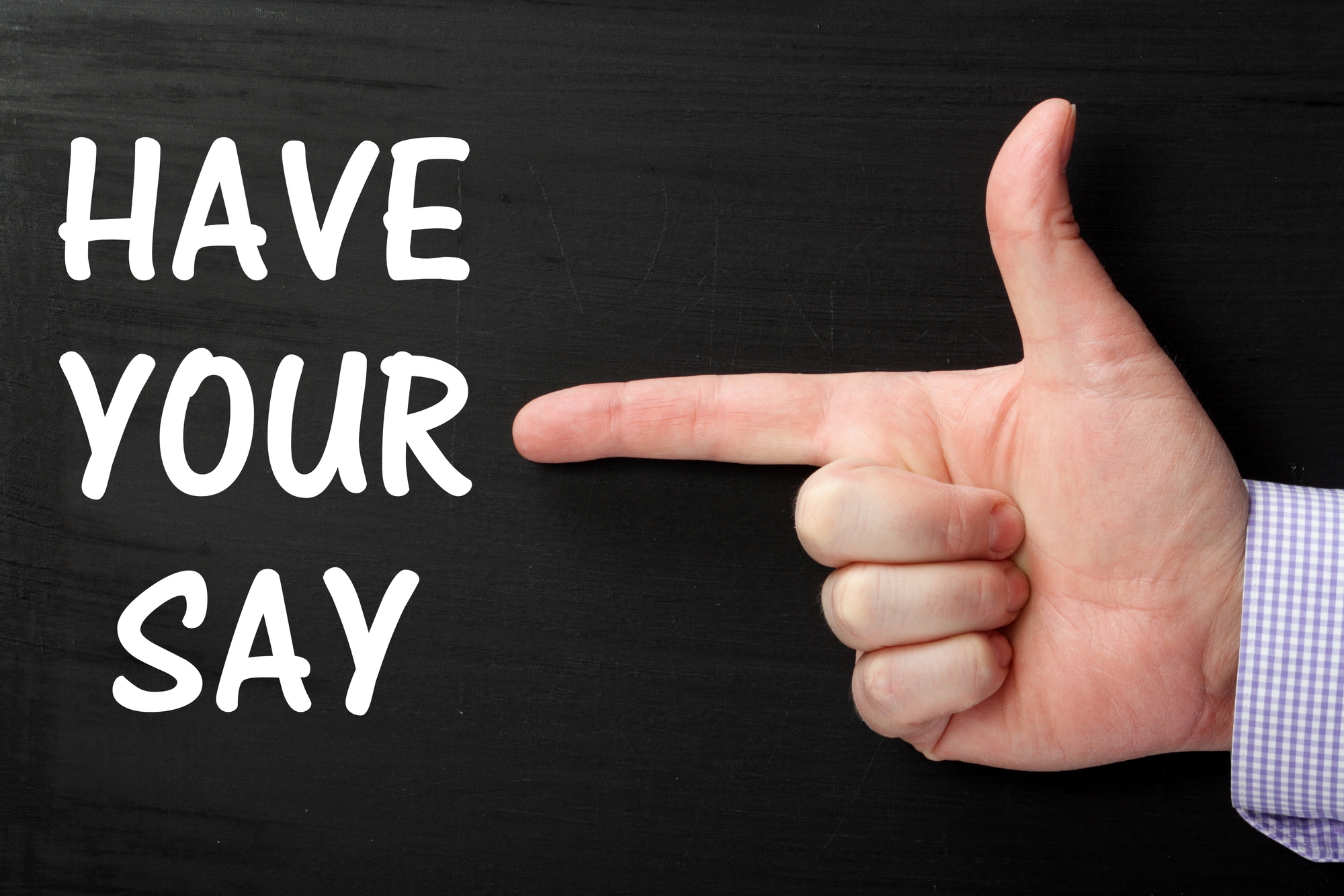 Have Your Say - white words Have Your Say with a person pointing towards the words