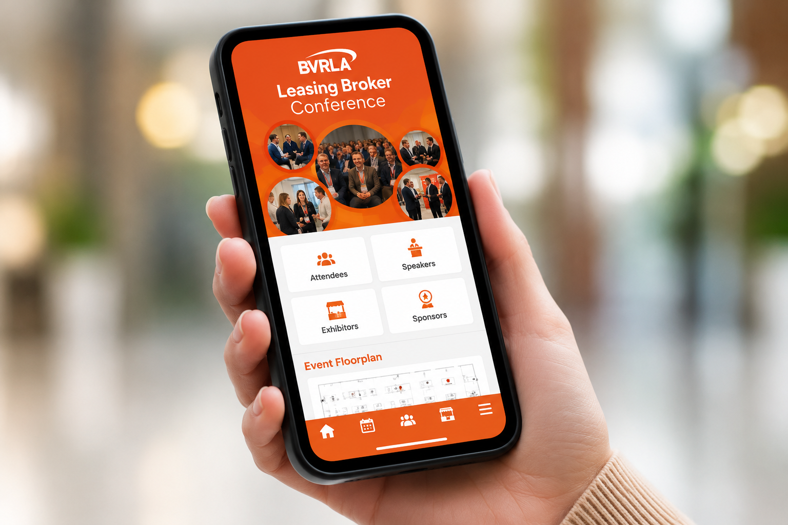 BVRLA Events app on a mobile phone in a person's hand, screen shows the BVRLA Leasing Broker Conference