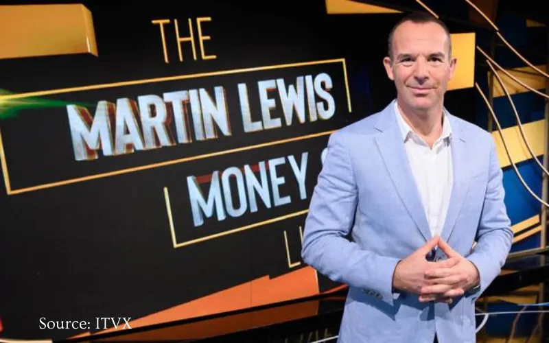Money expert and TV presenter Martin Lewis in front of sign saying The Martin Lewis Money Show