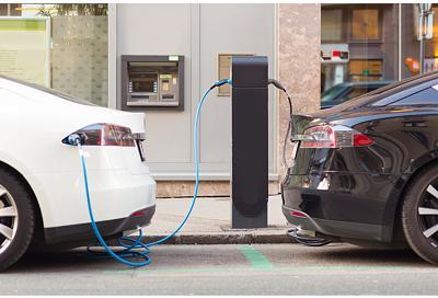 Policy-Decarbonisation-Electric-Vehicle-EV-two-cars-charging-01 720x490 carousel size.jpg